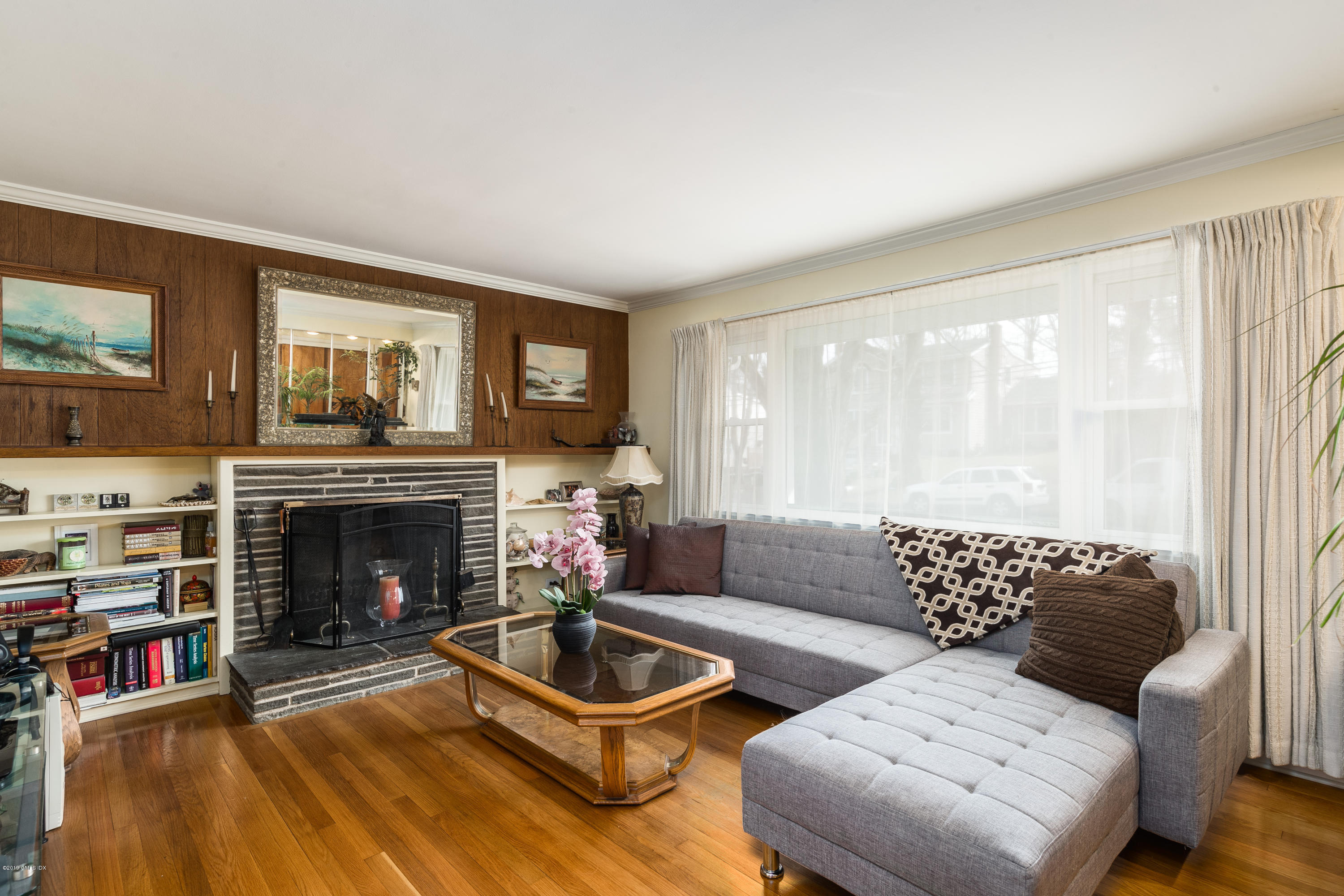 19 Sunshine Avenue Riverside, CT 06878 - Photo 2 of 14 a living room with furniture and a fireplace
