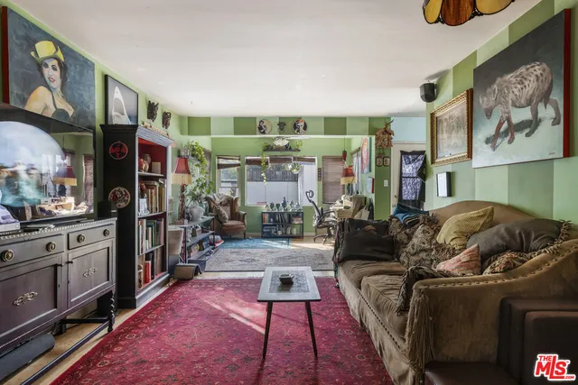 a living room with furniture and a rug