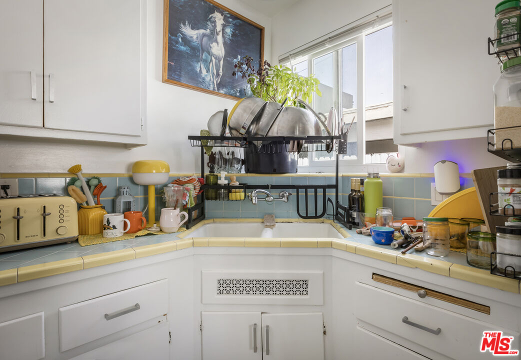 2912 Bellevue Avenue Los Angeles, CA 90026 - Photo 30 of 38 a kitchen with sink and cabinets