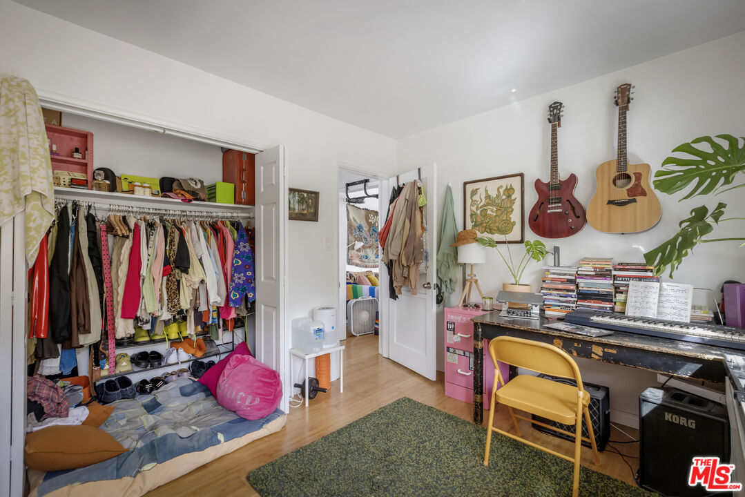 2912 Bellevue Avenue Los Angeles, CA 90026 - Photo 33 of 38 a view of walk in closet with clothes and shoes
