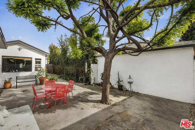a backyard of a house with seating space