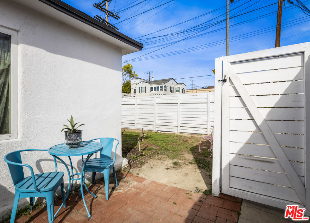 2912 Bellevue Avenue Los Angeles, CA 90026 - Photo 9 of 38 a view of a patio with table and chairs and potted plants