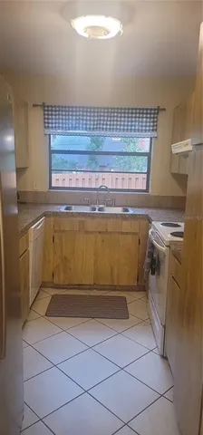 a view of a kitchen with storage and utility