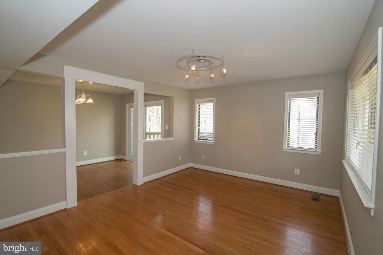 7820 Marconi Court Springfield, VA 22153 - Photo 11 of 29 an empty room with wooden floor and windows