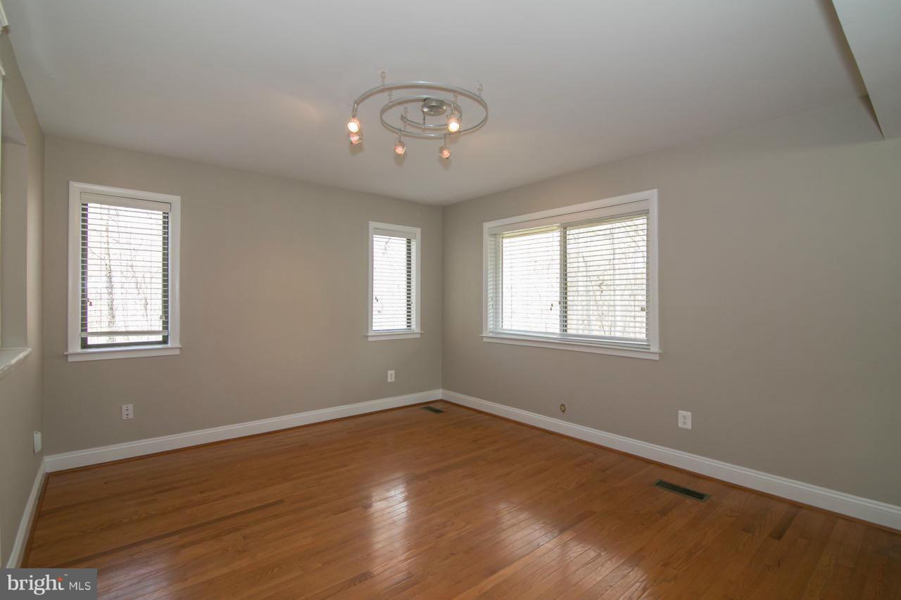 7820 Marconi Court Springfield, VA 22153 - Photo 12 of 29 a view of a room with wooden floor and window