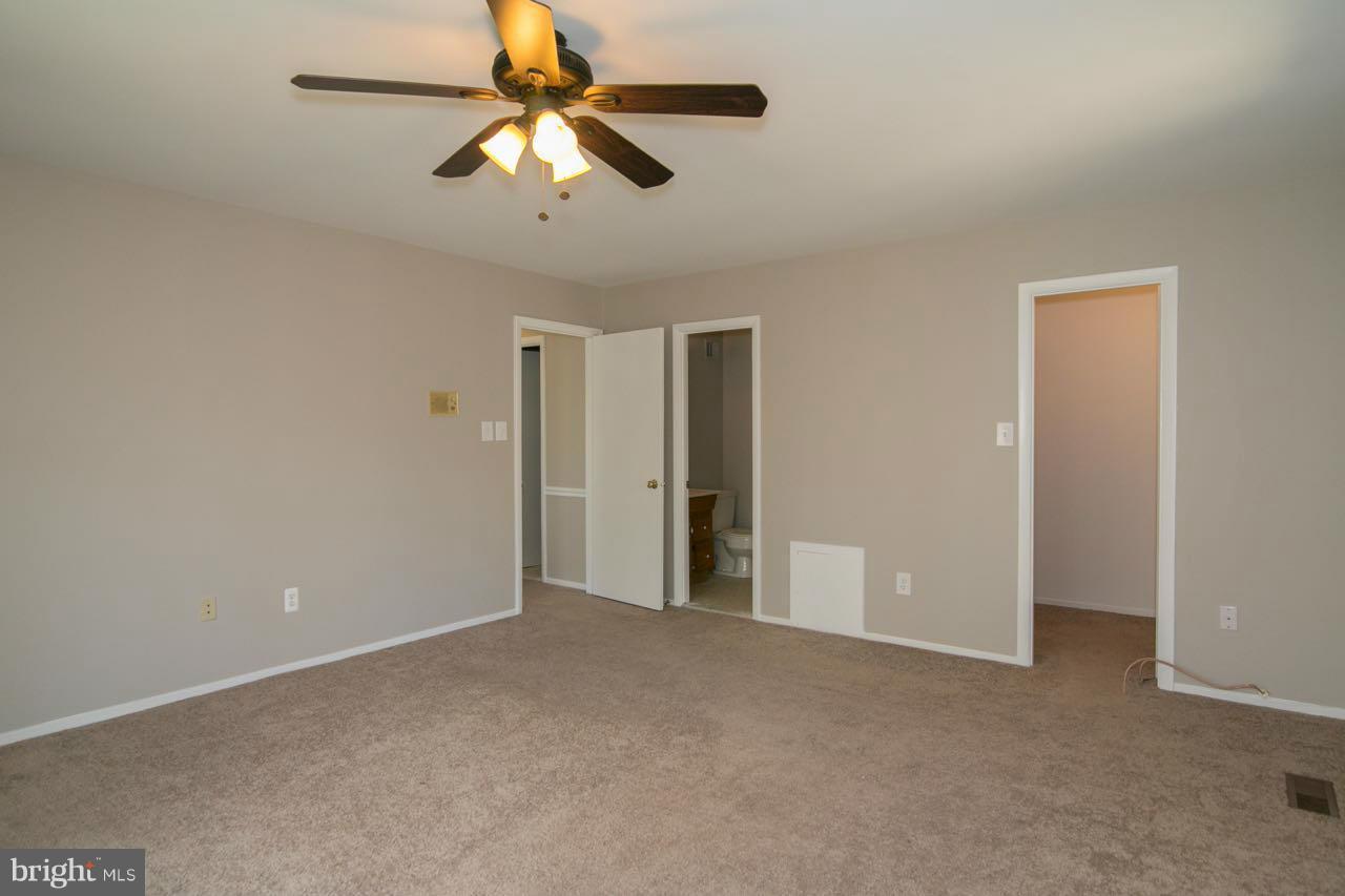 7820 Marconi Court Springfield, VA 22153 - Photo 17 of 29 a view of an empty room and chandelier fan