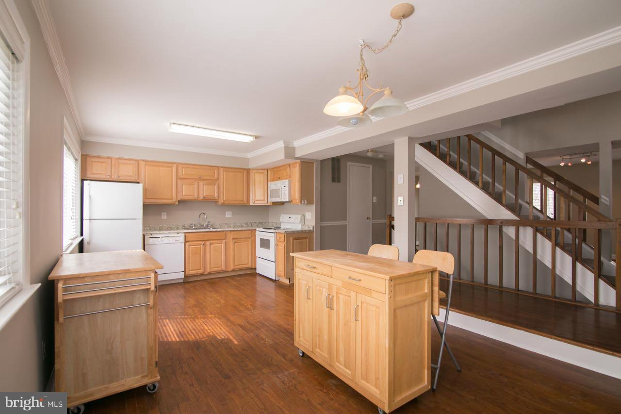7820 Marconi Court Springfield, VA 22153 - Photo 3 of 29 a room with furniture and a chandelier