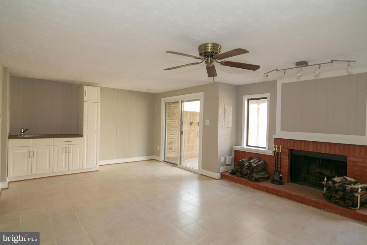 7820 Marconi Court Springfield, VA 22153 - Photo 24 of 29 a view of a livingroom with a fireplace and window