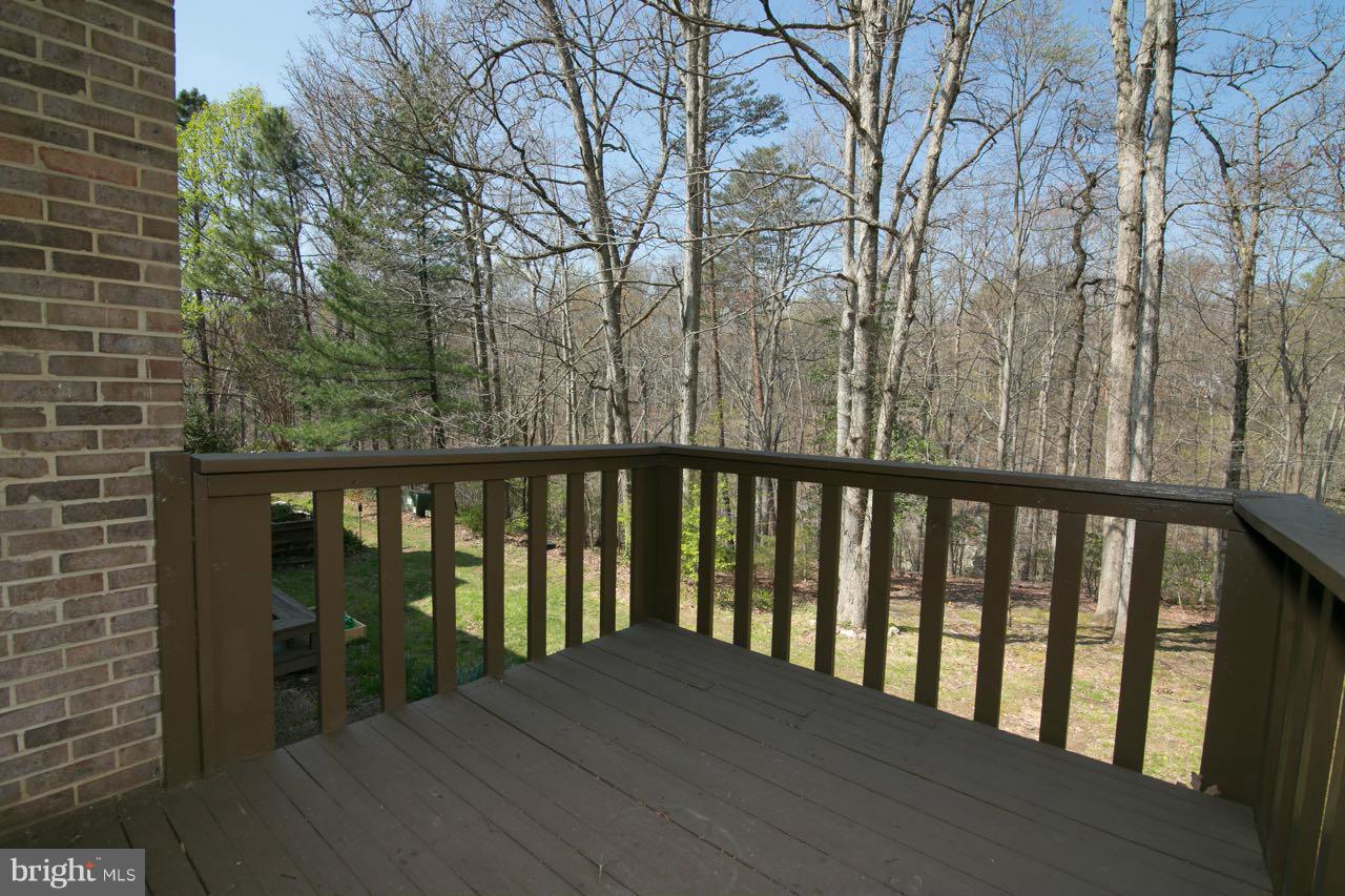 7820 Marconi Court Springfield, VA 22153 - Photo 26 of 29 a balcony with wooden floor and fence