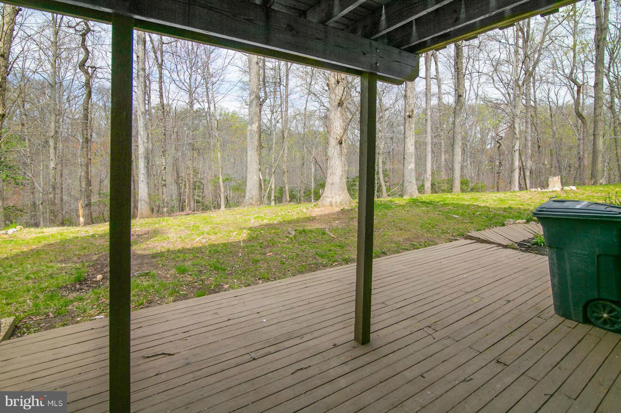 7820 Marconi Court Springfield, VA 22153 - Photo 28 of 29 a view of a porch with wooden floor and a yard