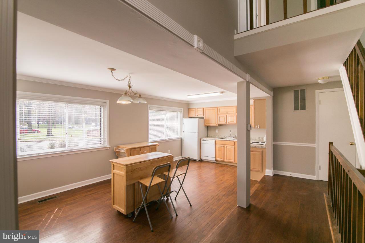 7820 Marconi Court Springfield, VA 22153 - Photo 6 of 29 a view of a livingroom with furniture window and wooden floor
