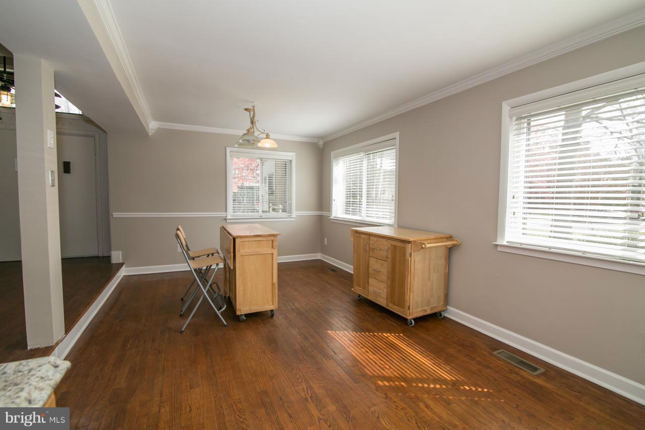 7820 Marconi Court Springfield, VA 22153 - Photo 7 of 29 a view of a livingroom with furniture window and wooden floor