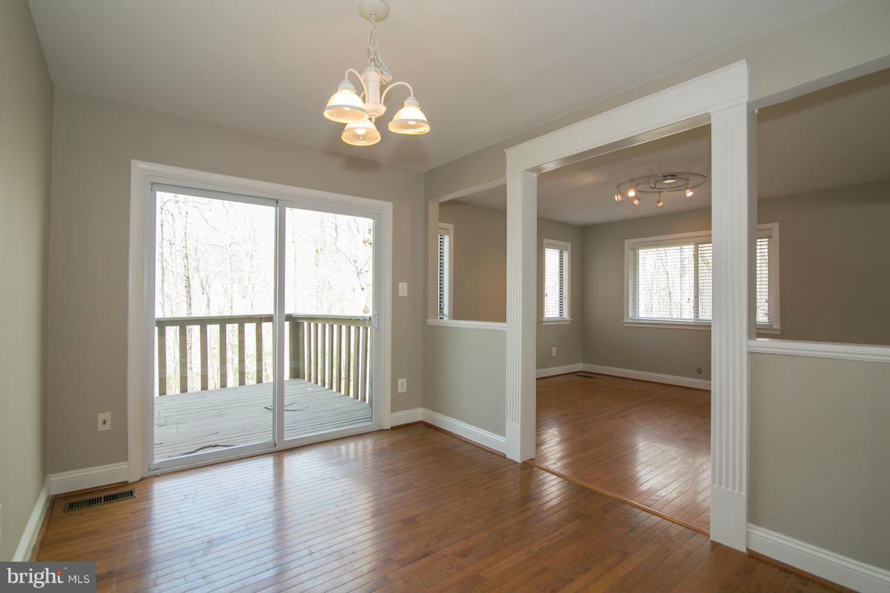 7820 Marconi Court Springfield, VA 22153 - Photo 9 of 29 an empty room with wooden floor and windows