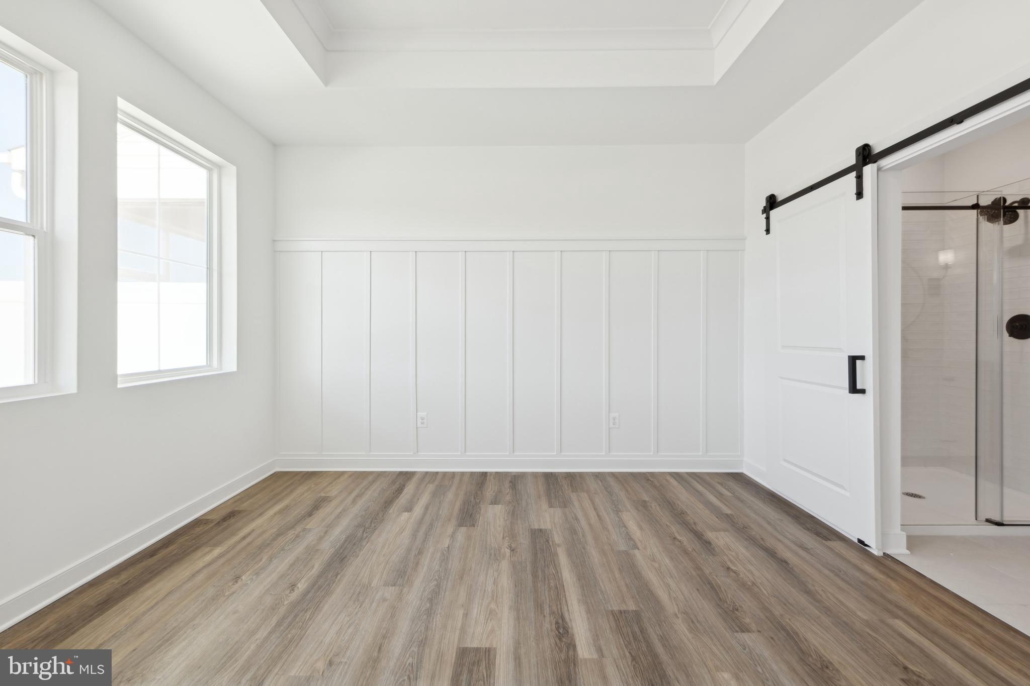 19707 Crows Nest Court Georgetown, DE 19947 - Photo 26 of 30 a view of a room with wooden floor closet and windows