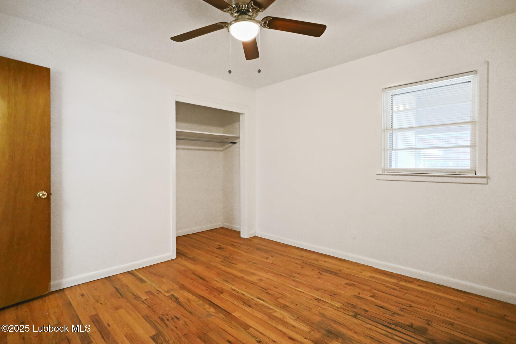 2315 Ithaca Avenue Lubbock, TX 79410 - Photo 14 of 30 a view of empty room with wooden floor