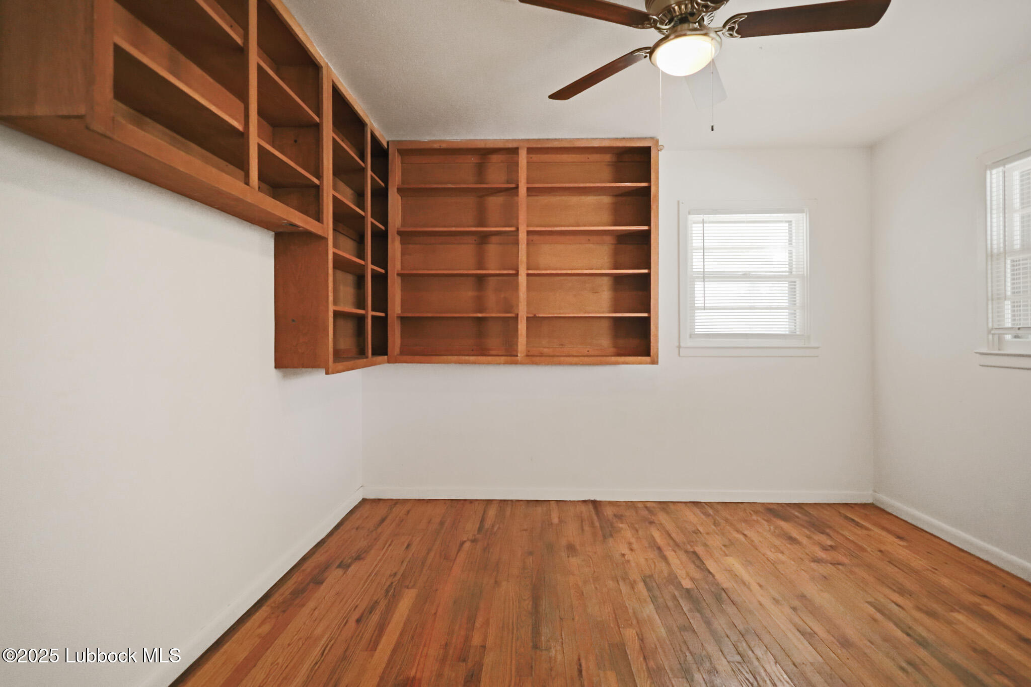 2315 Ithaca Avenue Lubbock, TX 79410 - Photo 20 of 30 a view of a room with wooden floor and staircase