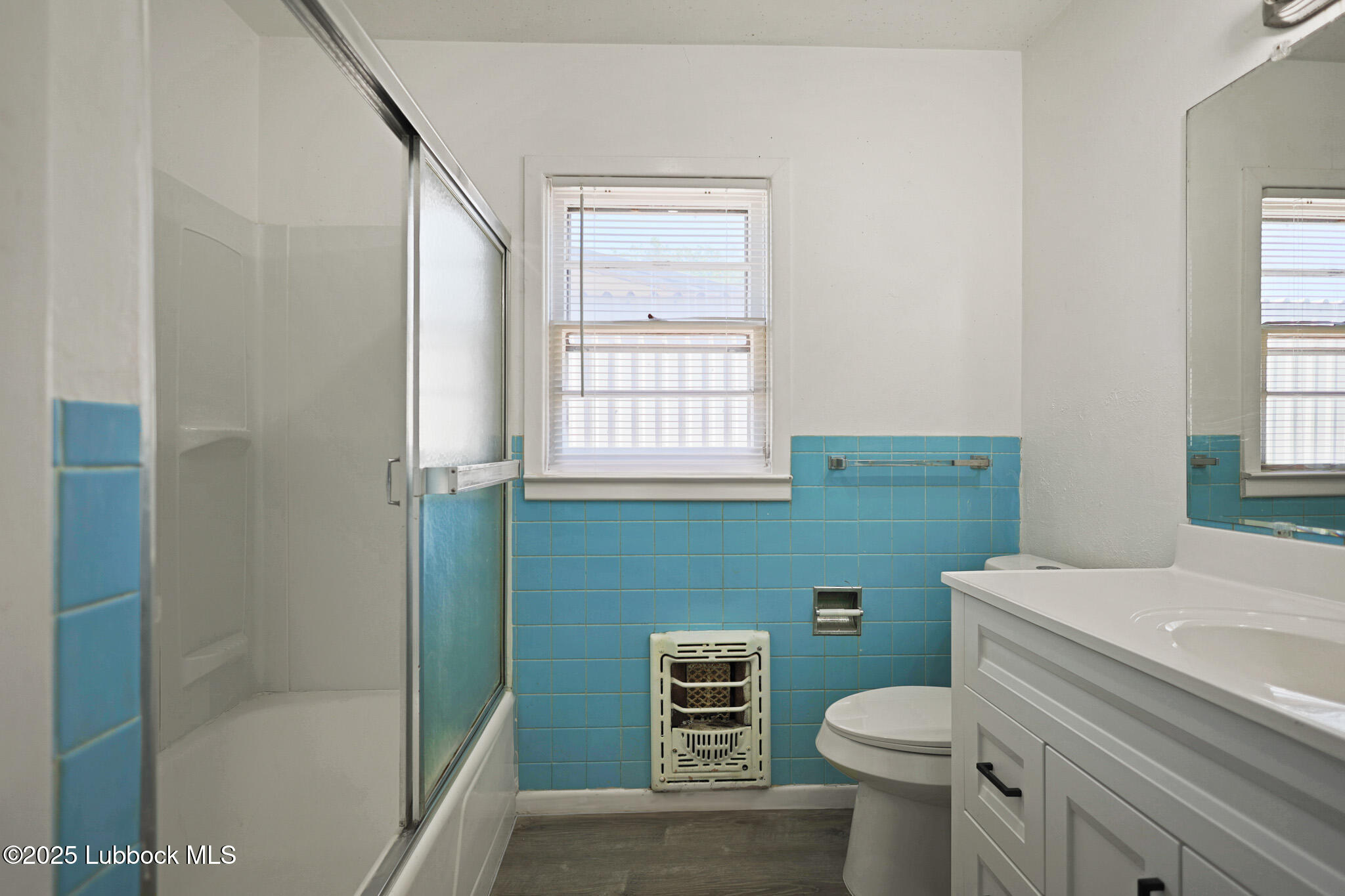 2315 Ithaca Avenue Lubbock, TX 79410 - Photo 25 of 30 a bathroom with a sink a toilet and shower