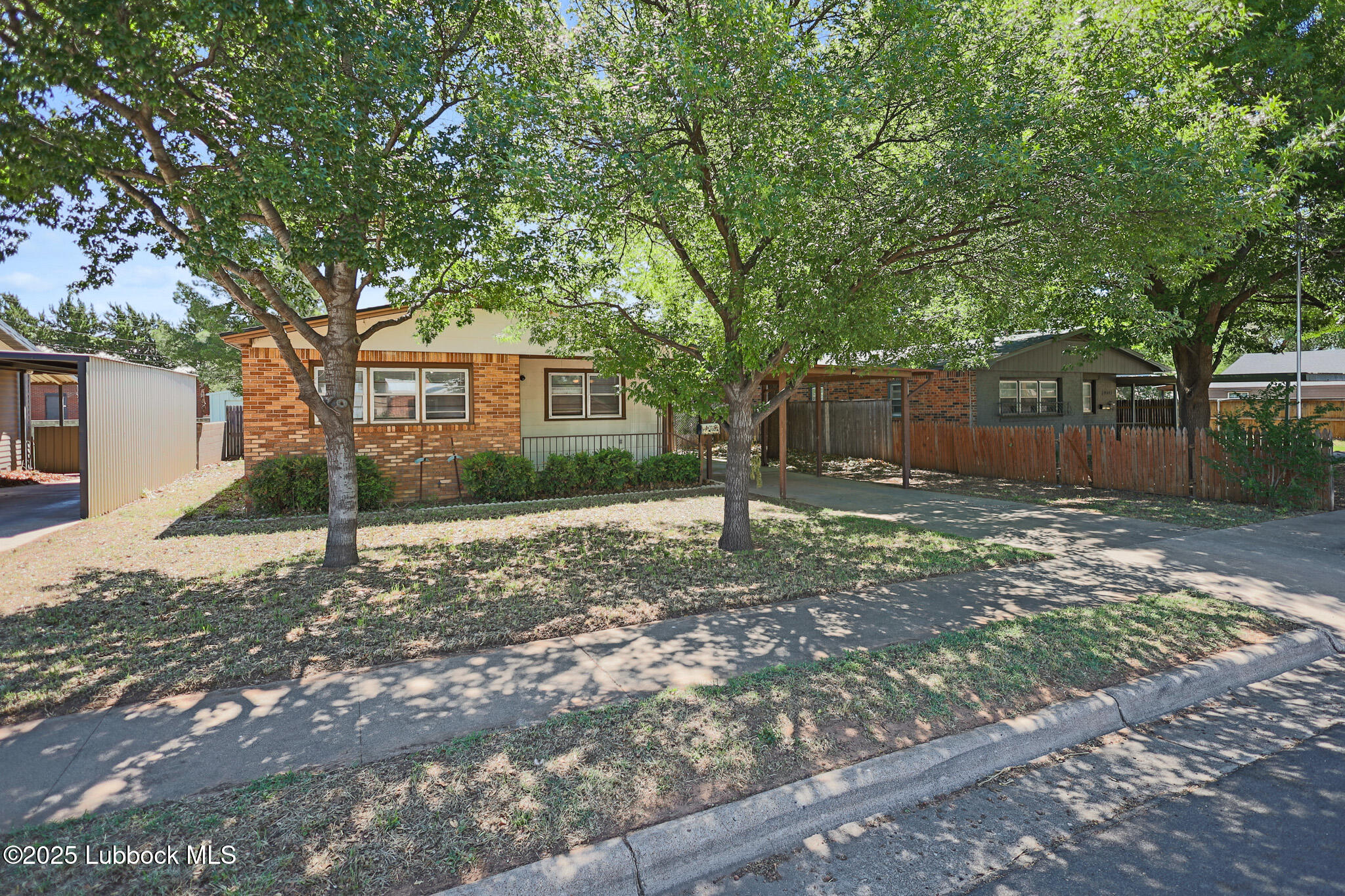 2315 Ithaca Avenue Lubbock, TX 79410 - Photo 3 of 30 a backyard of a house with lots of green space