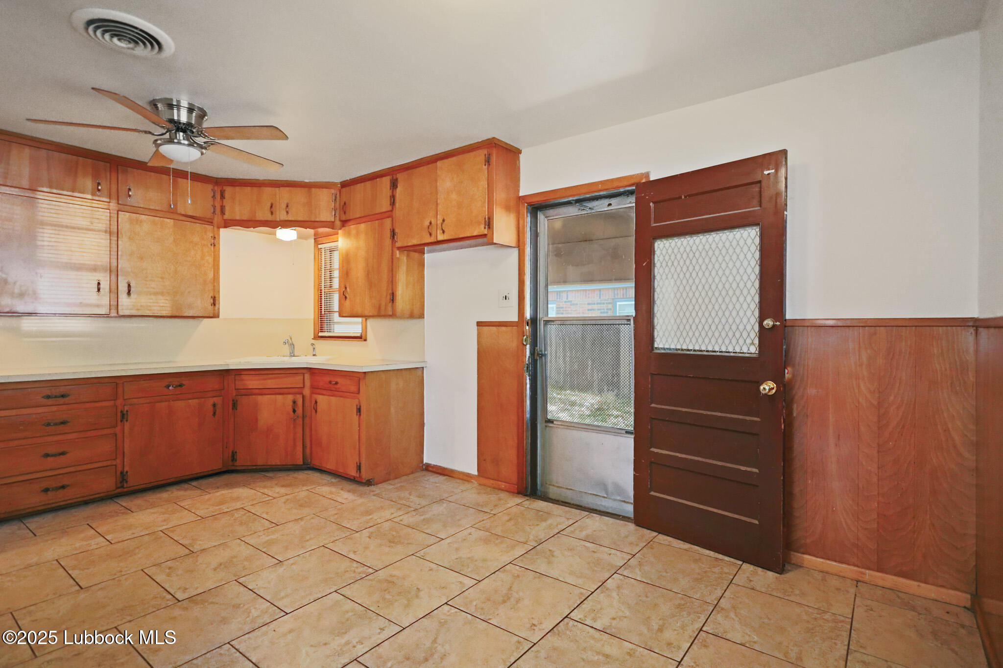 2315 Ithaca Avenue Lubbock, TX 79410 - Photo 9 of 30 a room with a dresser and a window