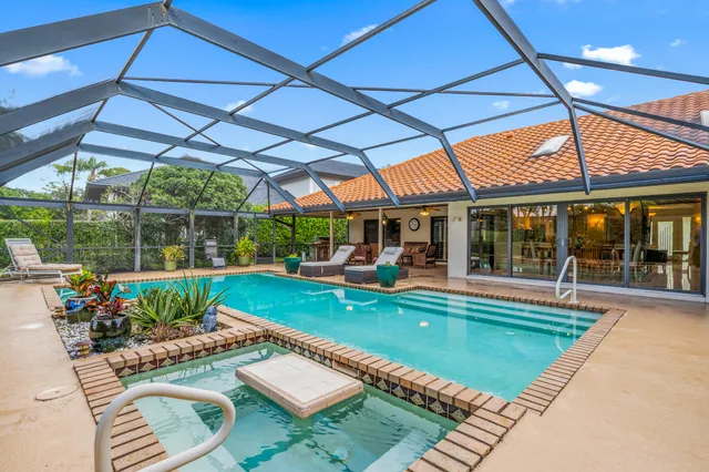 a view of a swimming pool with a patio