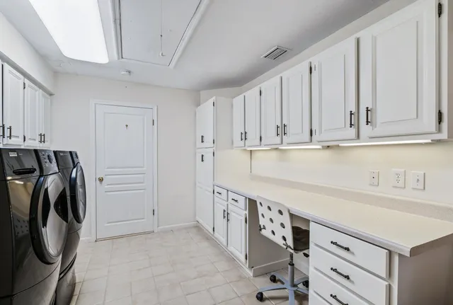 a kitchen with a sink a washer and dryer
