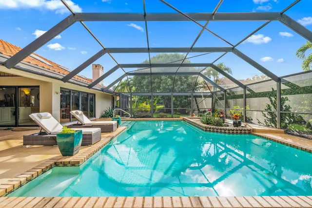 a view of swimming pool with outdoor seating