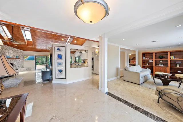 a view of a livingroom with furniture and windows