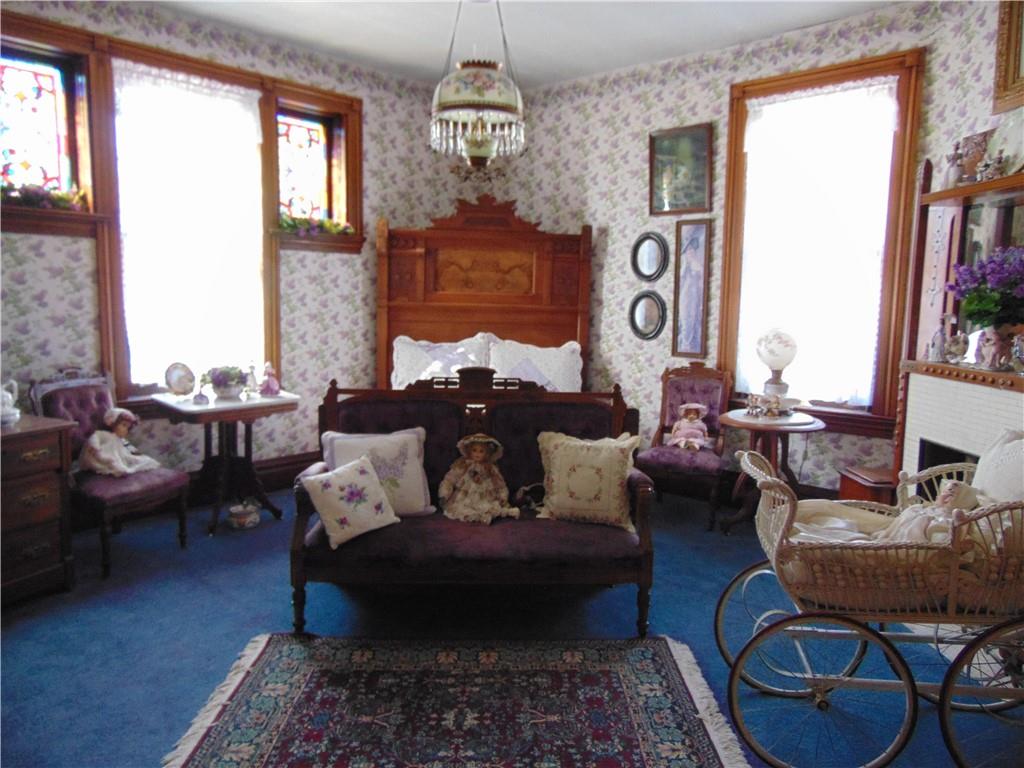 201 Main Street Dawson, PA 15428 - Photo 12 of 25 a living room with furniture and a large window