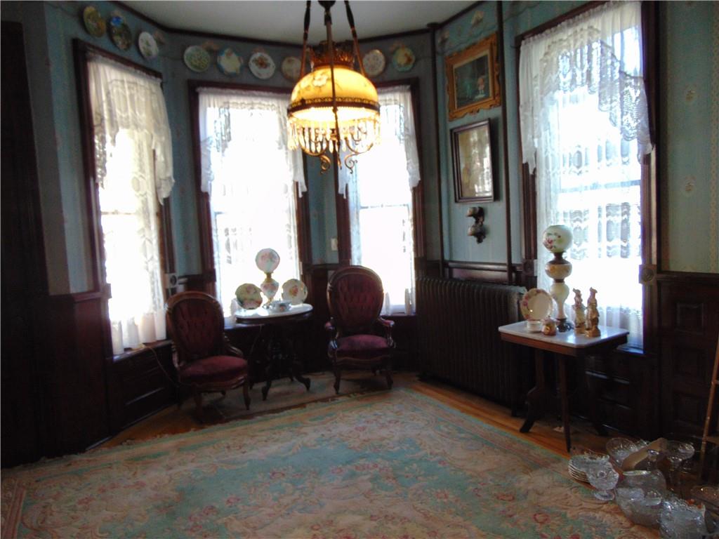 201 Main Street Dawson, PA 15428 - Photo 14 of 25 a living room with furniture and a large window