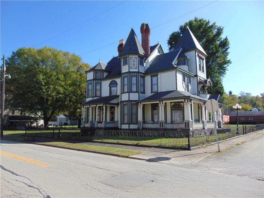 201 Main Street Dawson, PA 15428 - Photo 3 of 25 a front view of a house with a yard
