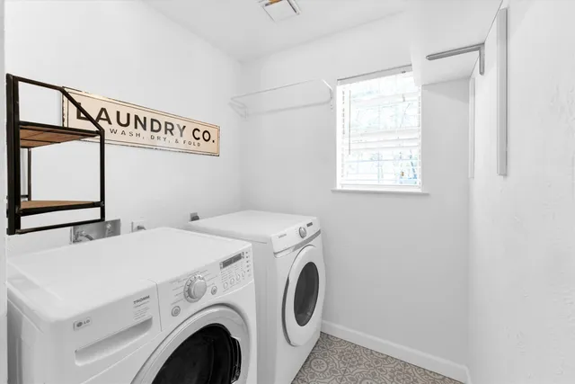 a utility room with dryer and washer