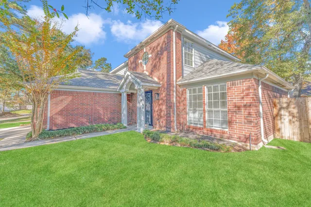 a backyard of a house with lots of green space