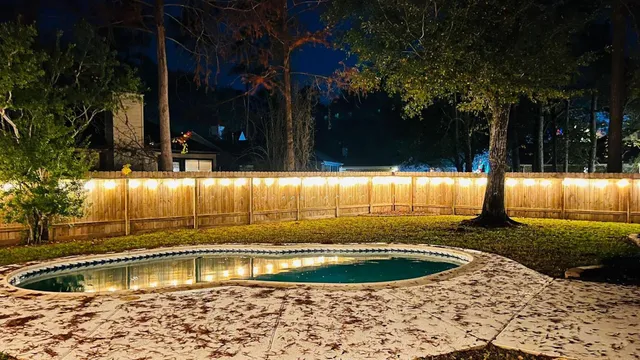 a view of a swimming pool with a patio