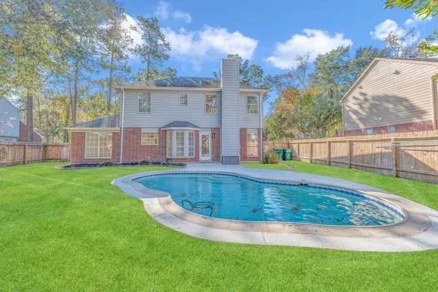 a view of a house with a swimming pool