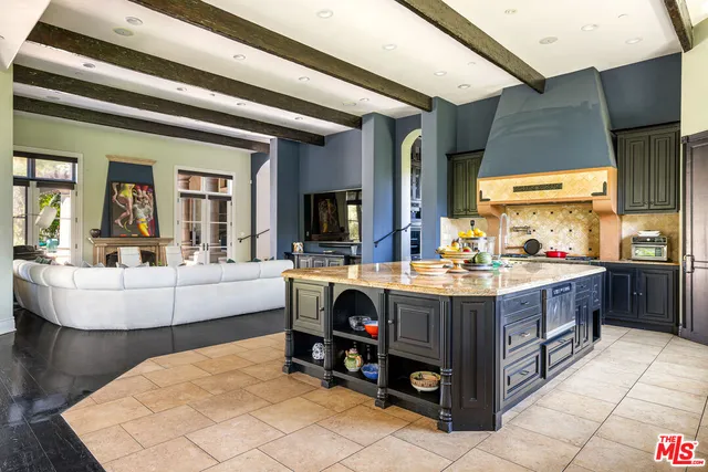 a view of living room with granite countertop furniture and fireplace