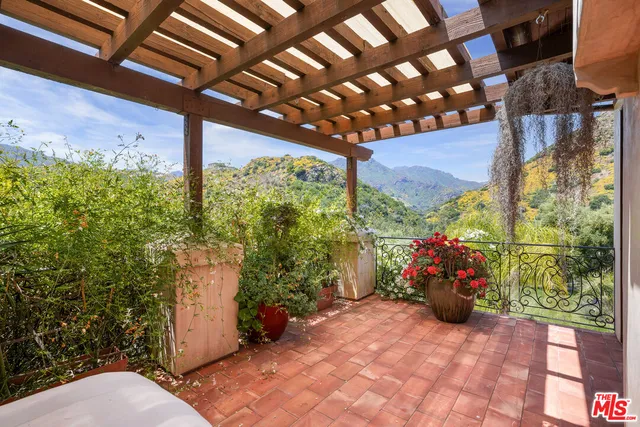 a bathroom with a double vanity sink mirror and bathtub