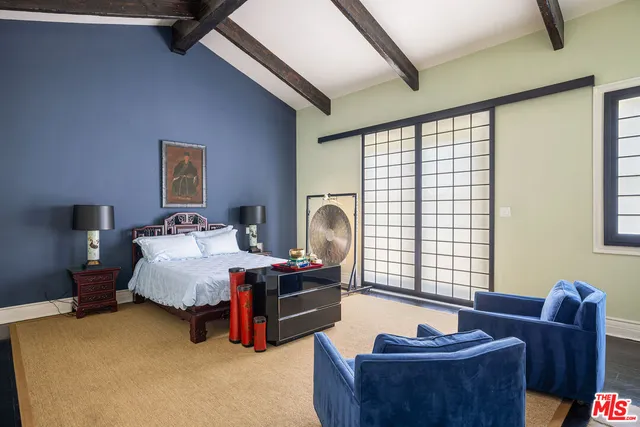 a view of game room with window and hardwood floor