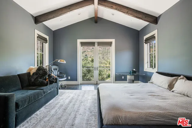 a view of a swimming pool with a yard