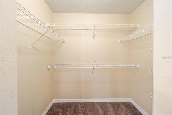 a view of a room with racks on the wall