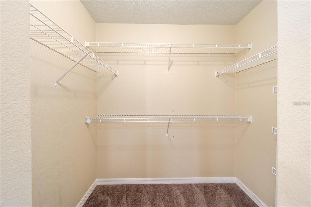 14308 Northwest 161st Avenue Alachua, FL 32615 - Photo 20 of 52 a view of a room with racks on the wall