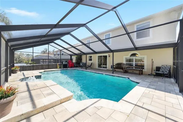 a view of a backyard with sitting area