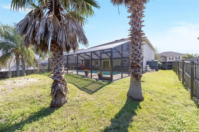 a house view with a sitting space and garden