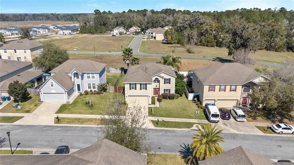 an aerial view of a house with outdoor space