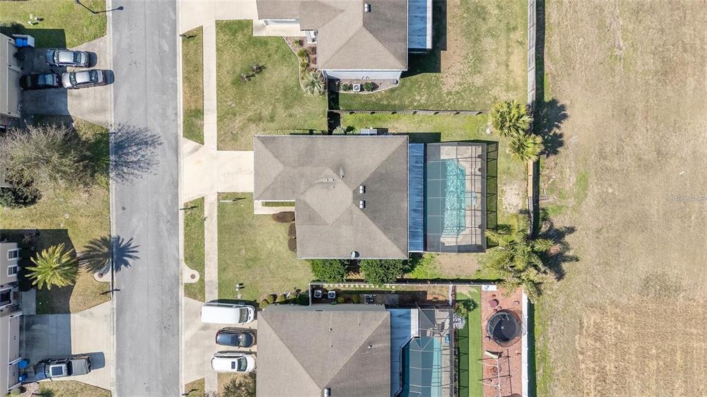 14308 Northwest 161st Avenue Alachua, FL 32615 - Photo 43 of 52 an aerial view of a residential apartment building with a yard and potted plants