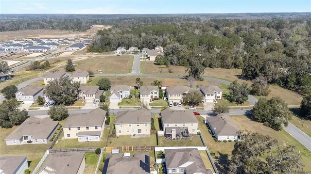 an aerial view of residential house with outdoor space