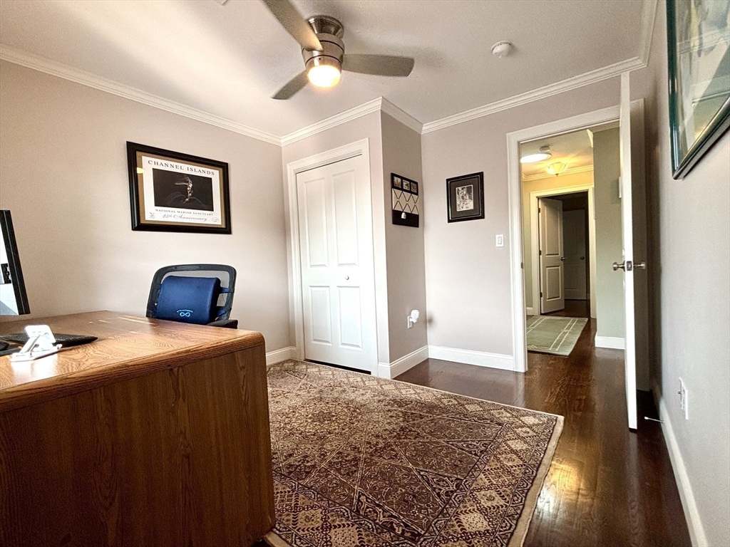 9 Endicott Street, Unit B Danvers, MA 01923 - Photo 20 of 42 a bedroom with a bed and wooden floor