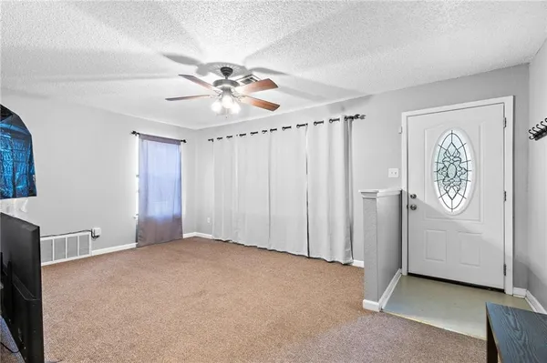 a view of a livingroom with a flat screen tv
