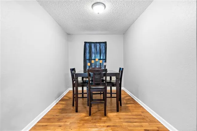 a kitchen with a stove a sink and a refrigerator