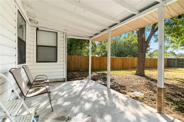 a backyard of a house with seating space