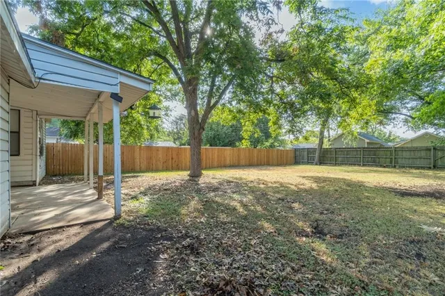 a backyard of a house with lots of green space